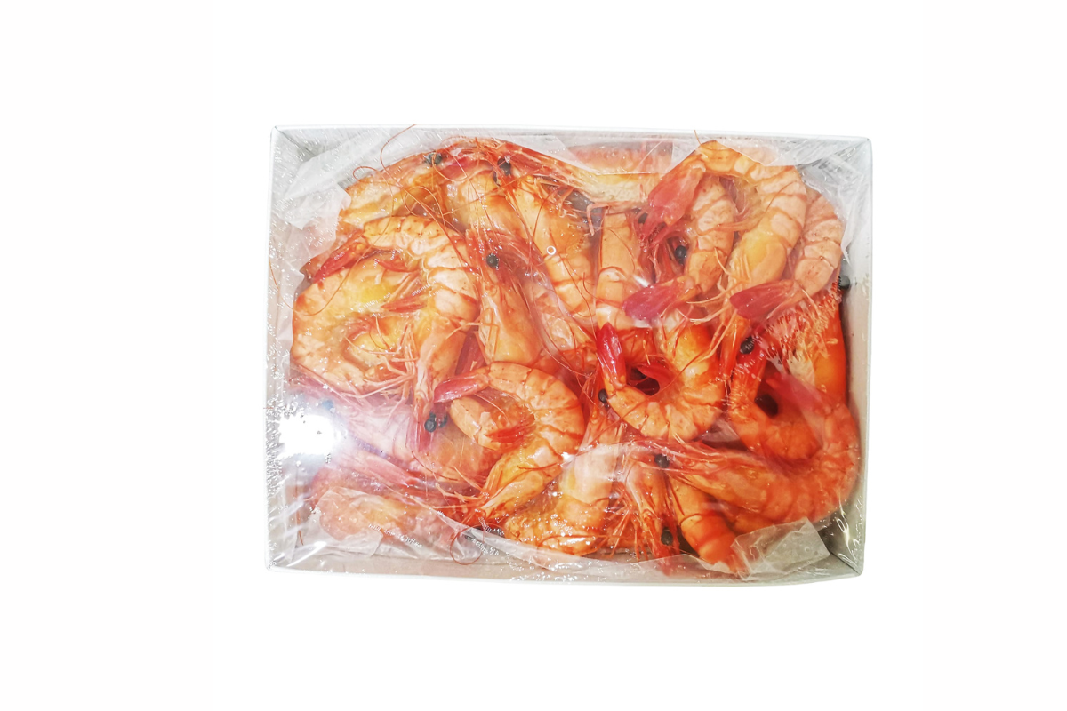 Packaged shrimps in clear plastic on a white background