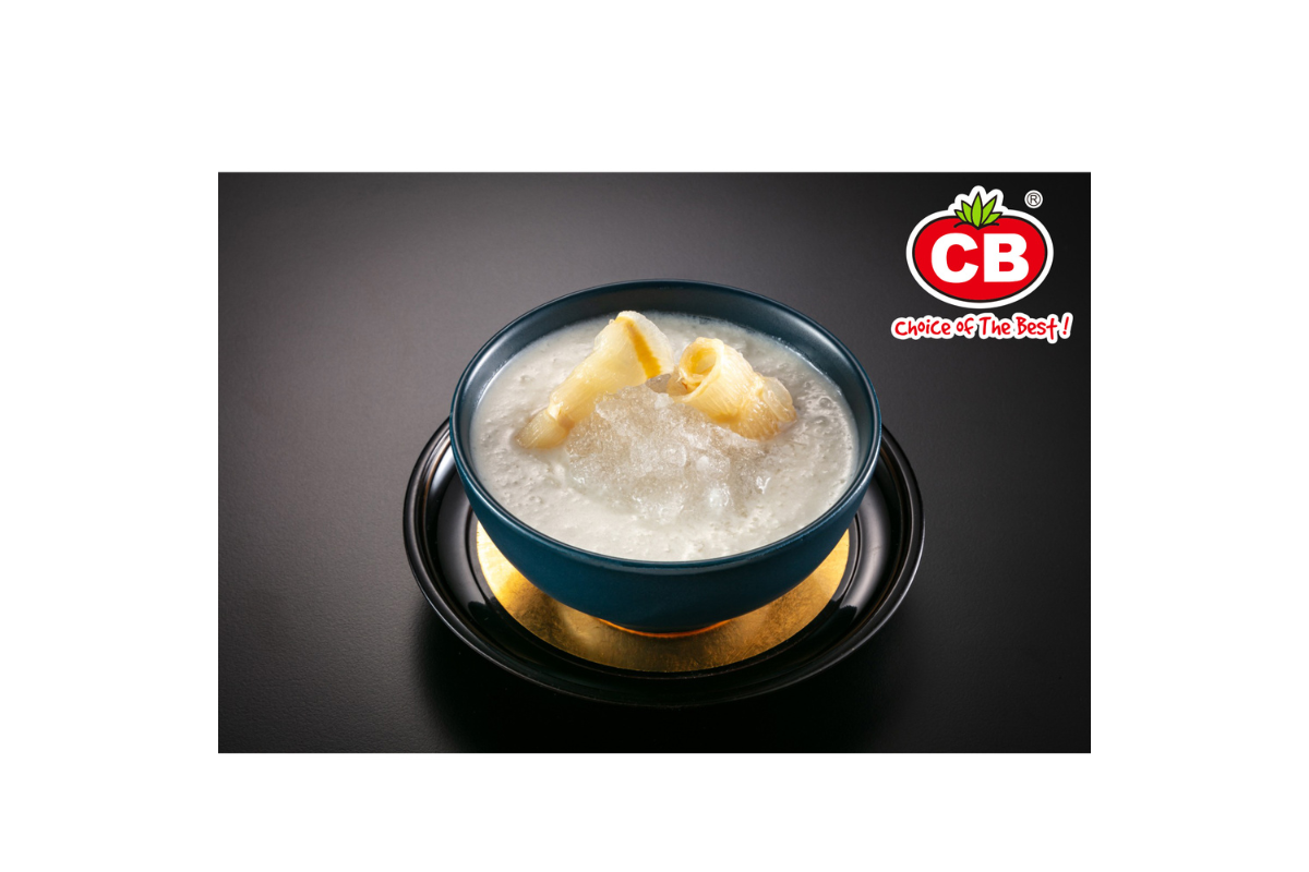 Bowl of dessert with a spoon on a black background, featuring the CB logo.