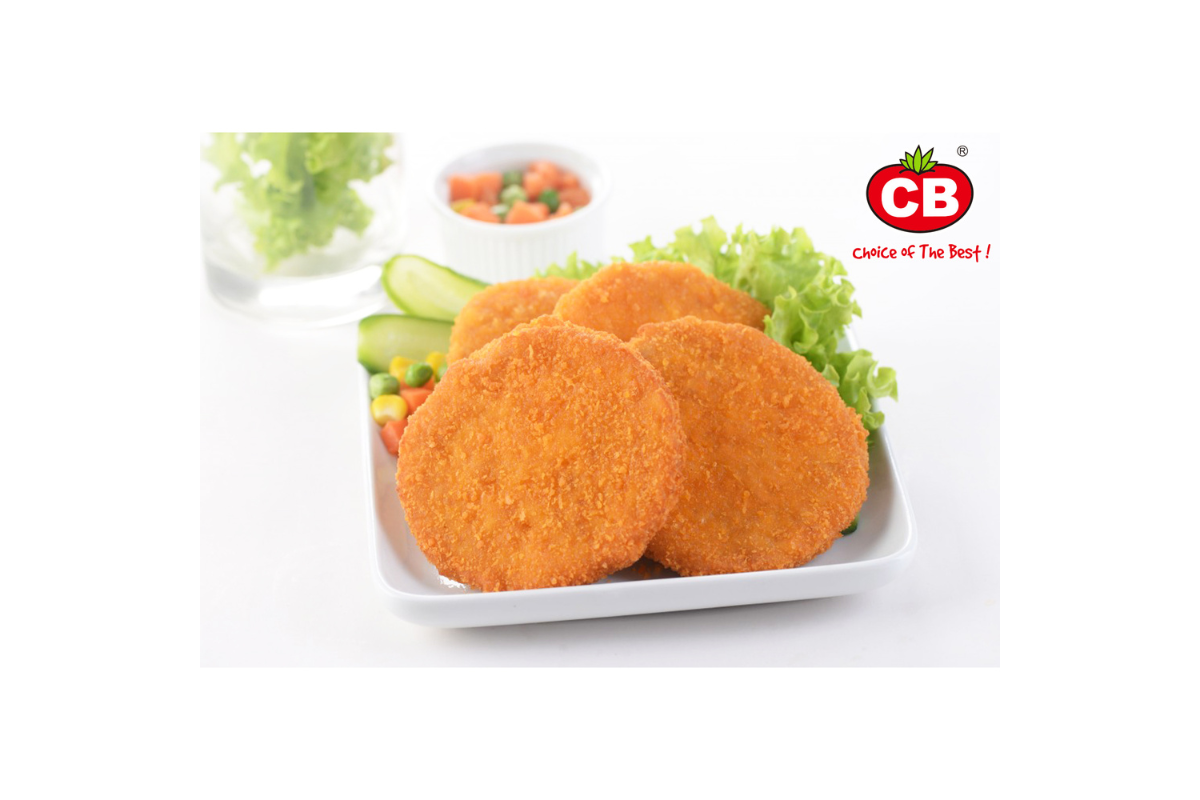 Three breaded meat patties on a white plate with vegetables and a visible CB logo.