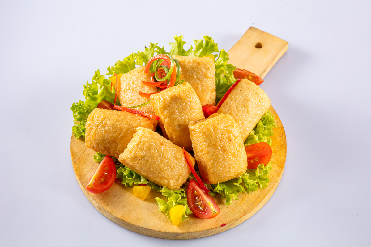 Seafood tofu with vegetables on a wooden board
