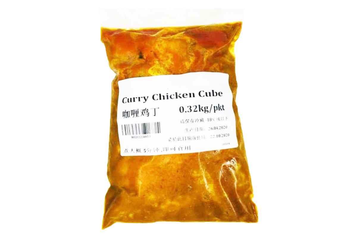 Packaged curry chicken cubes with a label on a white background