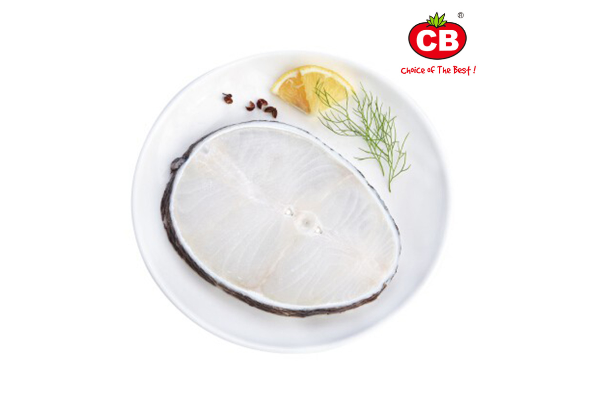 Raw fish fillet on a white plate with lemon, dill, and peppercorns, featuring the CB brand logo.