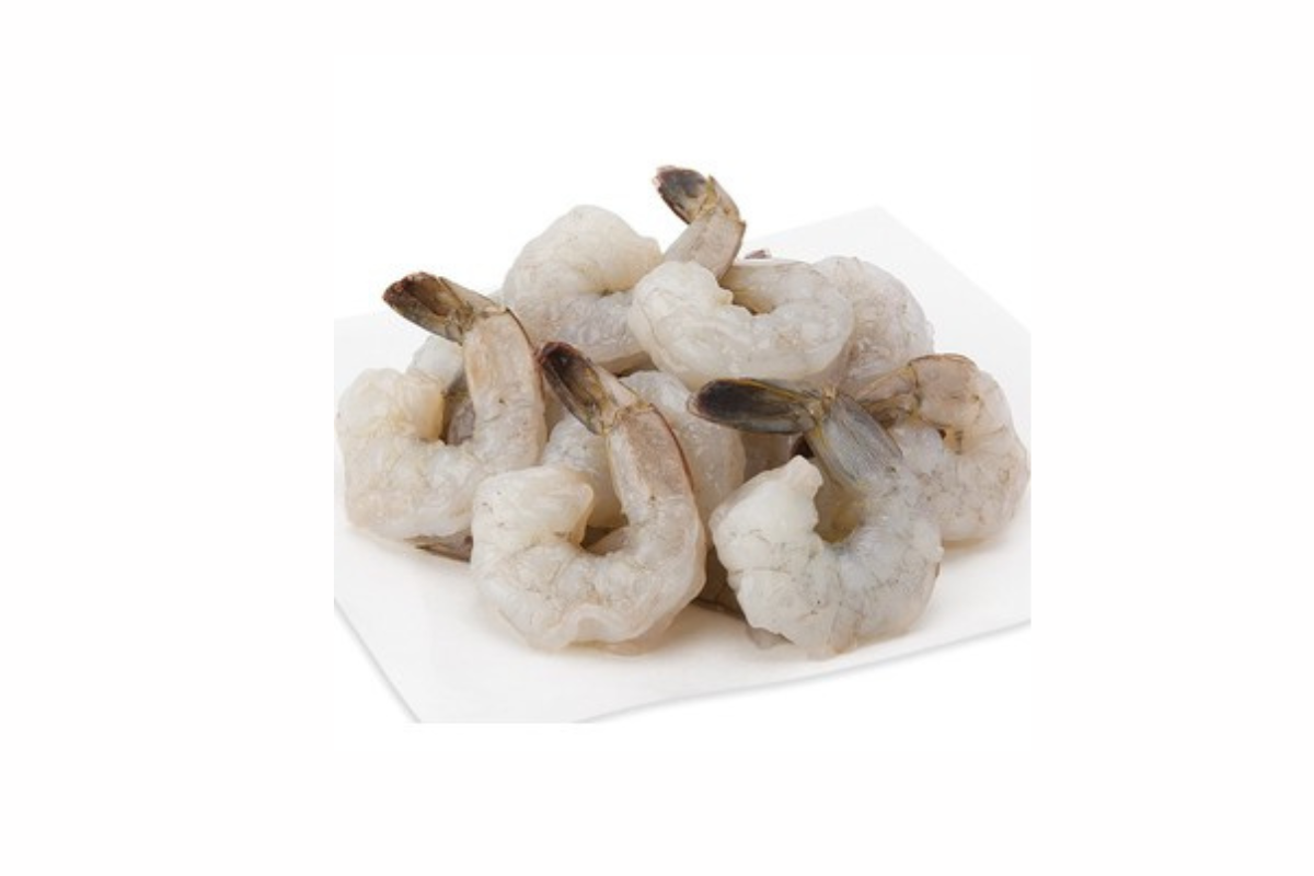Raw shrimp on a white plate with a white background
