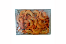 Packaged shrimp in clear plastic on a white background