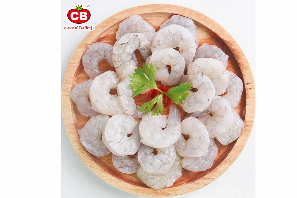 Raw shrimp in a wooden bowl with a CB brand logo in the corner