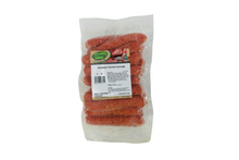 Packaged chicken sausages with a label on a white background