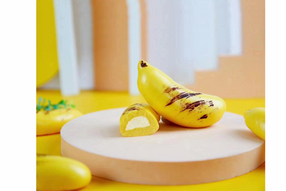 Banana bun on a white platform with a yellow background