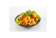 Fish dumpling with carrot on a plate