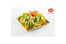Fish dumpling with veggies on a plate