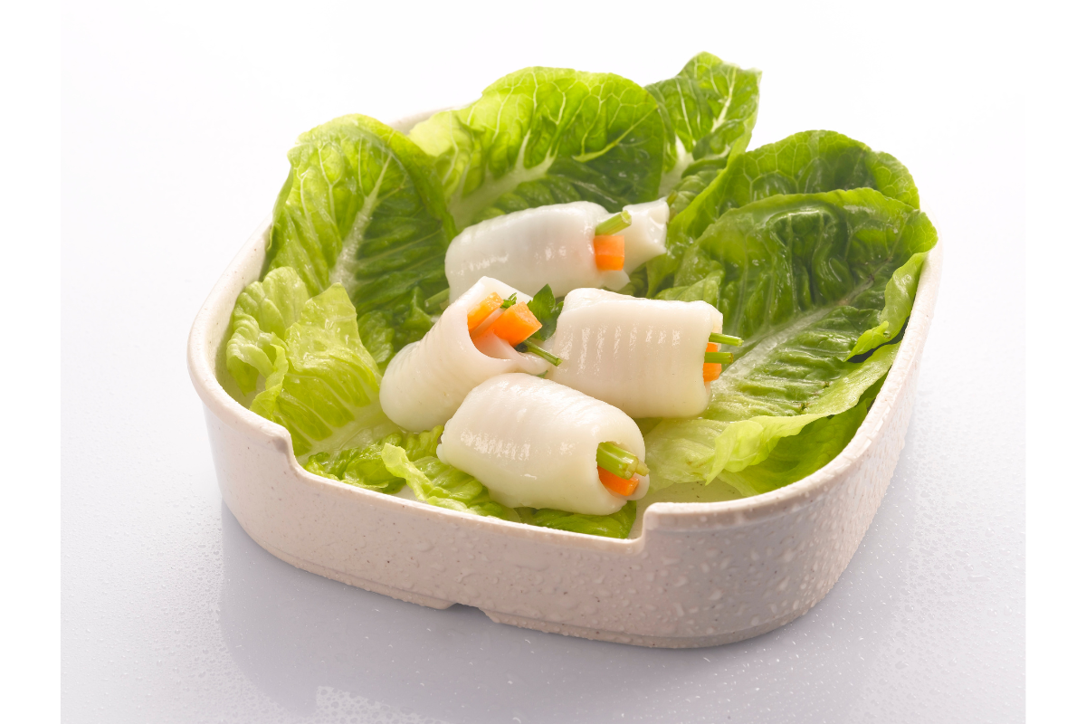 Fish vege roll with vegetables in a plate