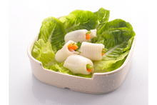 Fish vege roll with vegetables in a plate