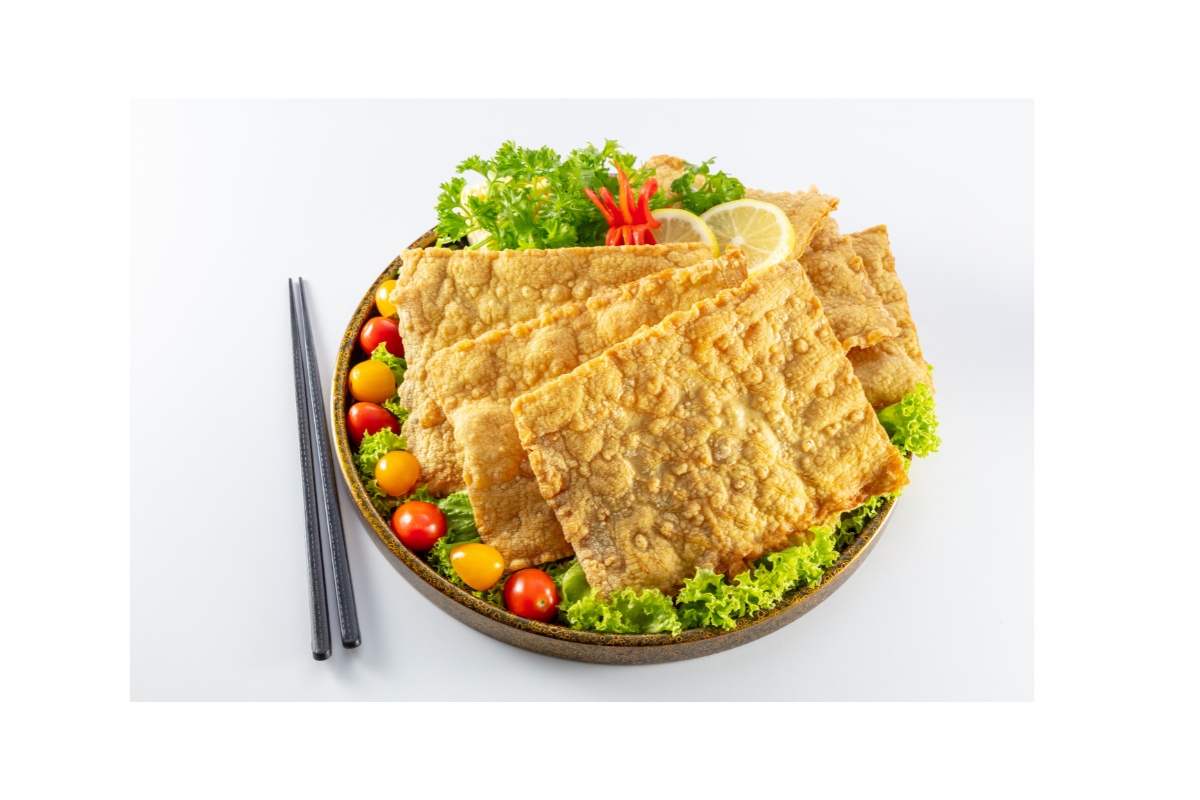 Fried tofu with vegetables on a white background