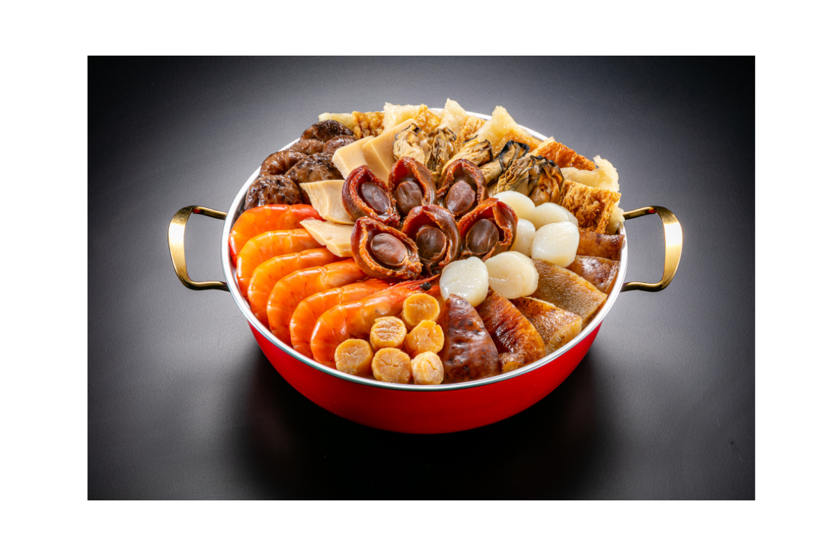 Assorted dried seafood in a red pot on a dark background