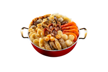 Red bowl filled with a variety of seafood and vegetables on a white background