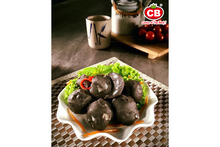 A plate of squid ink cuttlefish balls.