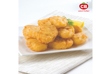 Fried chicken pieces on a white plate with a lemon wedge, branded 'CB'.
