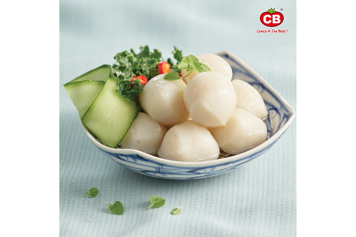 Bowl of scallops with garnishes on a light blue background, featuring the CB brand logo.