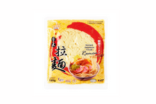 Packaged instant ramen noodles with a yellow background