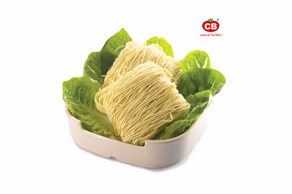 Noodles on a bed of lettuce in a white container with a visible brand logo.