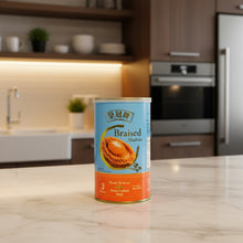 Can of braised abalone on a kitchen counter