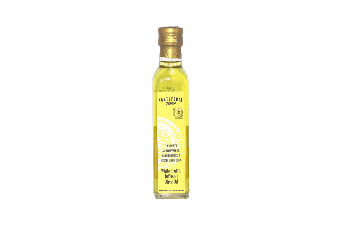 Bottle of olive oil with a gold cap on a white background