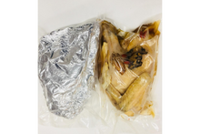 Two packages on a white background, one wrapped in tinfoil and the other in plastic.