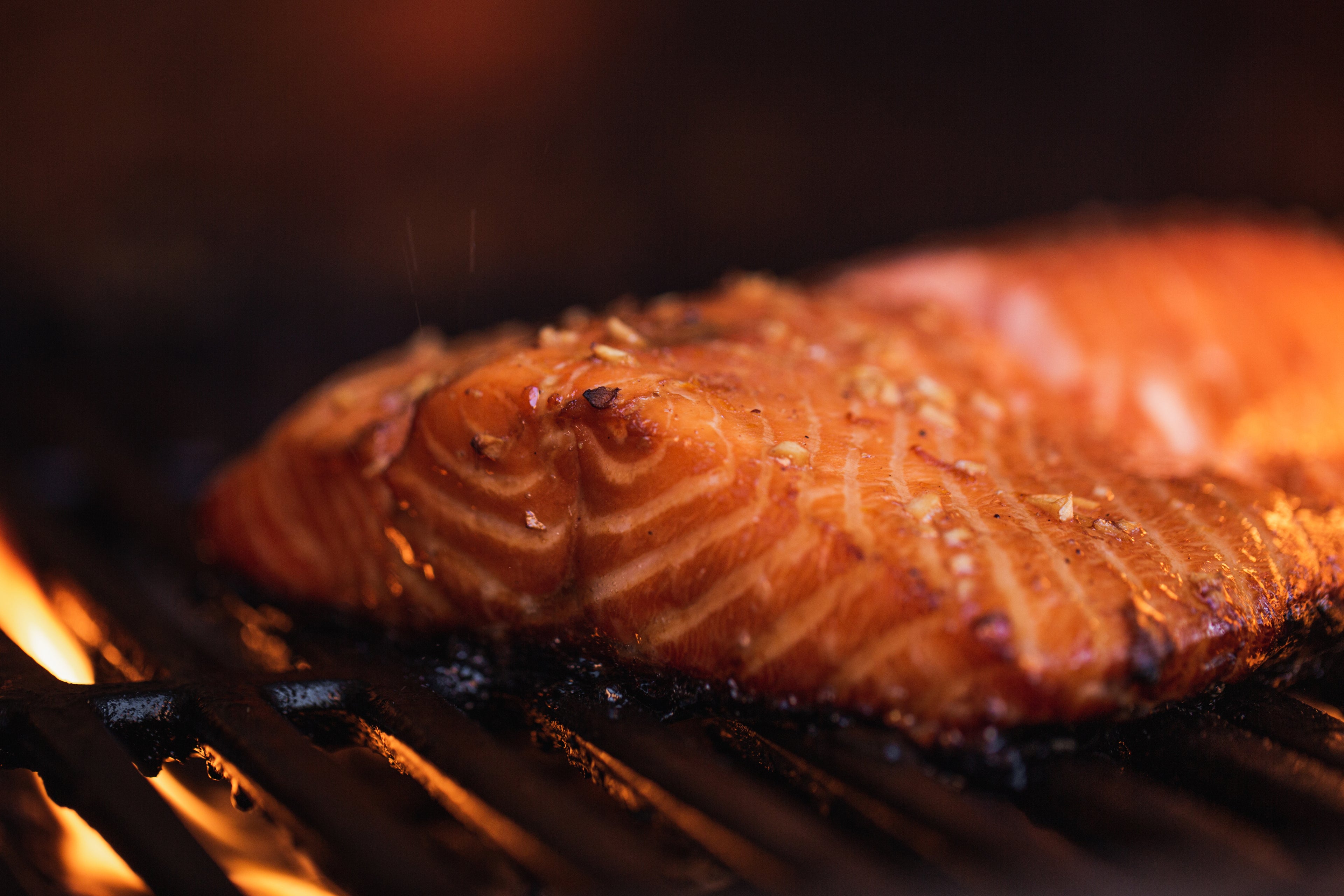 A picture of a piece of salmon on the grill